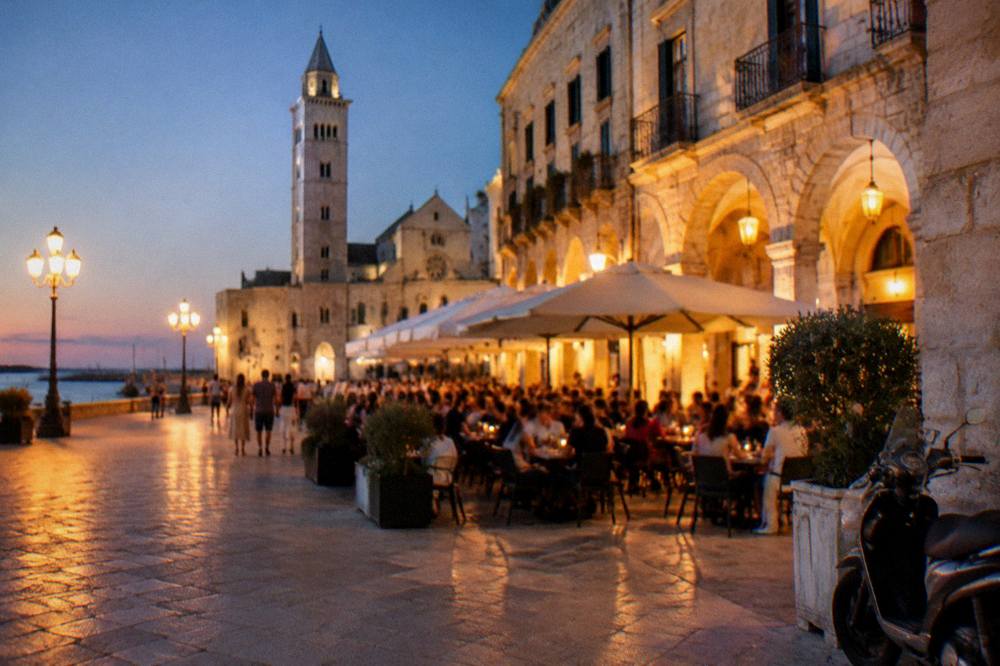 Evening piazza with warm light on cream walls, out-of-focus diners at tables and glowing market arches