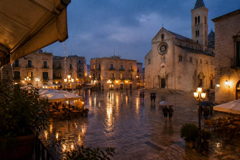 Rainy evening in a pale stone square with wet paving reflecting warm cafe lights and distant umbrellas